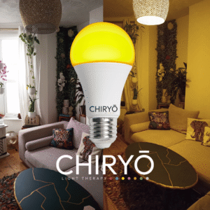 relax sunset amber light bulb E27 switched on in living room, before and after split image shows natural daylight showing sofa cushions and wall art in one half and after sunset amber light bulb on E27 US26 healthy lighting blue light free light bulbs CHIRYO LIGHT THERAPY
