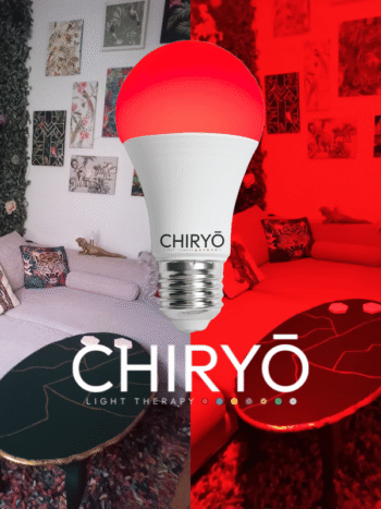 sleep red light bulb E27 switched on in living room, before and after split image shows natural daylight showing sofa cushions and wall art in one half and after SLEEP red light bulbs E27 healthy lighting blue light free light bulbs CHIRYO LIGHT THERAPY
