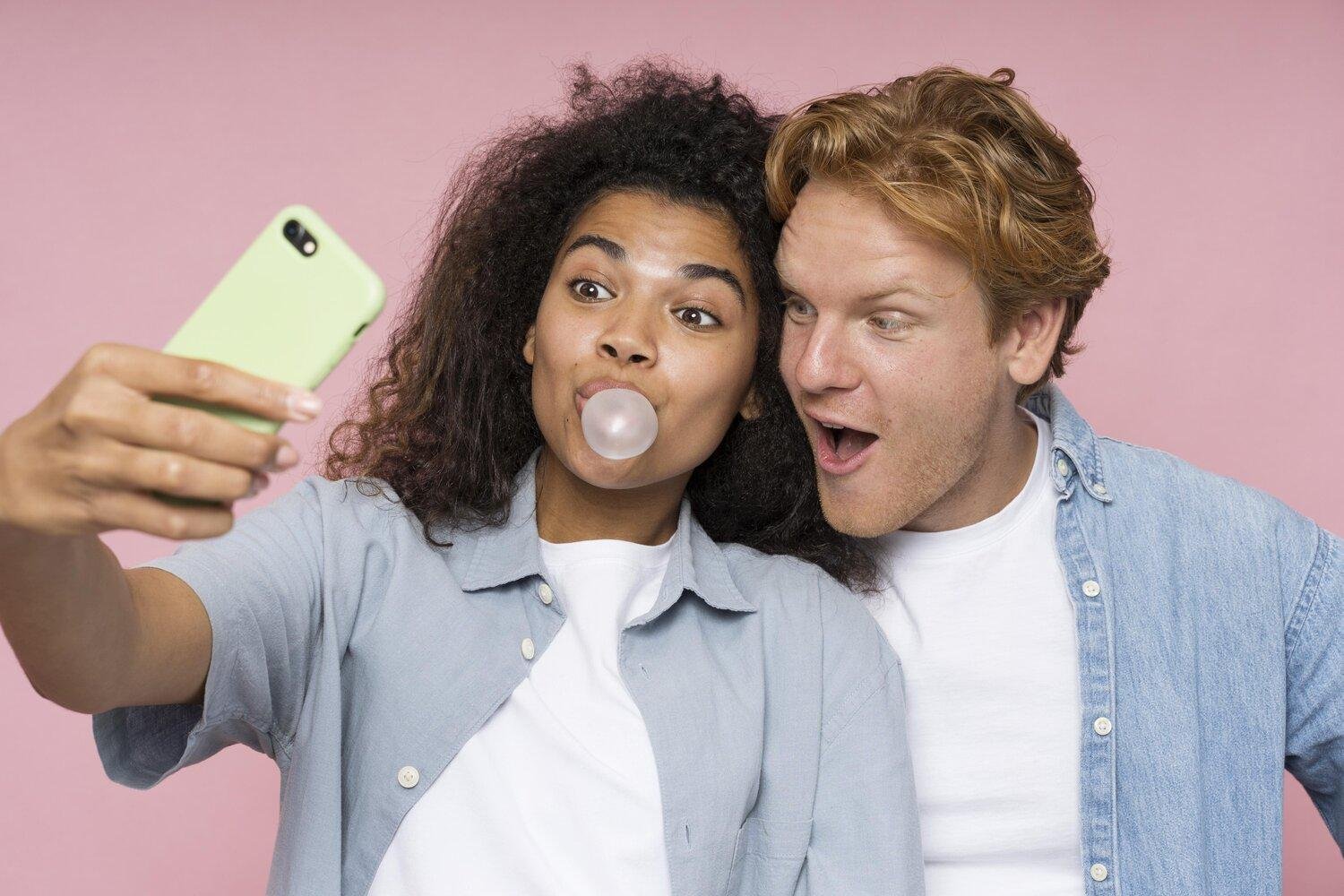 Ointments and Skincare wisdom article blog how to maximise the benefits of LED Light Therapy CHIRYO Light Therapy happy teenagers young adults taking a selfie female blowing a ball from bubble gum