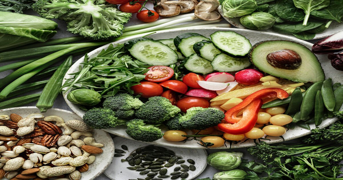 Raw veggies and nuts flat lay food photography plant based diet selection of veg and nuts